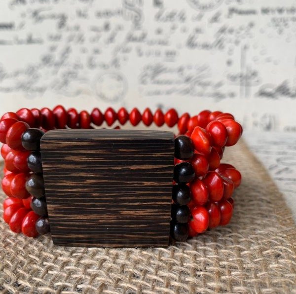 Red seed and wood statement bracelet