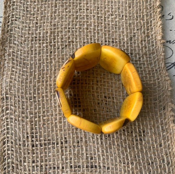 Yellow statement bracelet made of Tagua Nuts